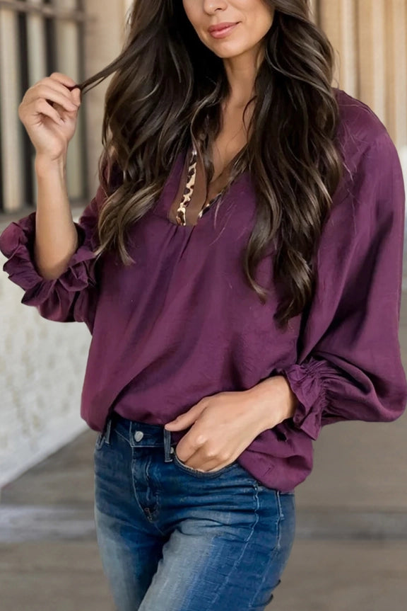 purple blouse with leopard neckline