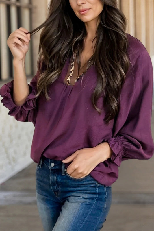 purple blouse with leopard neckline